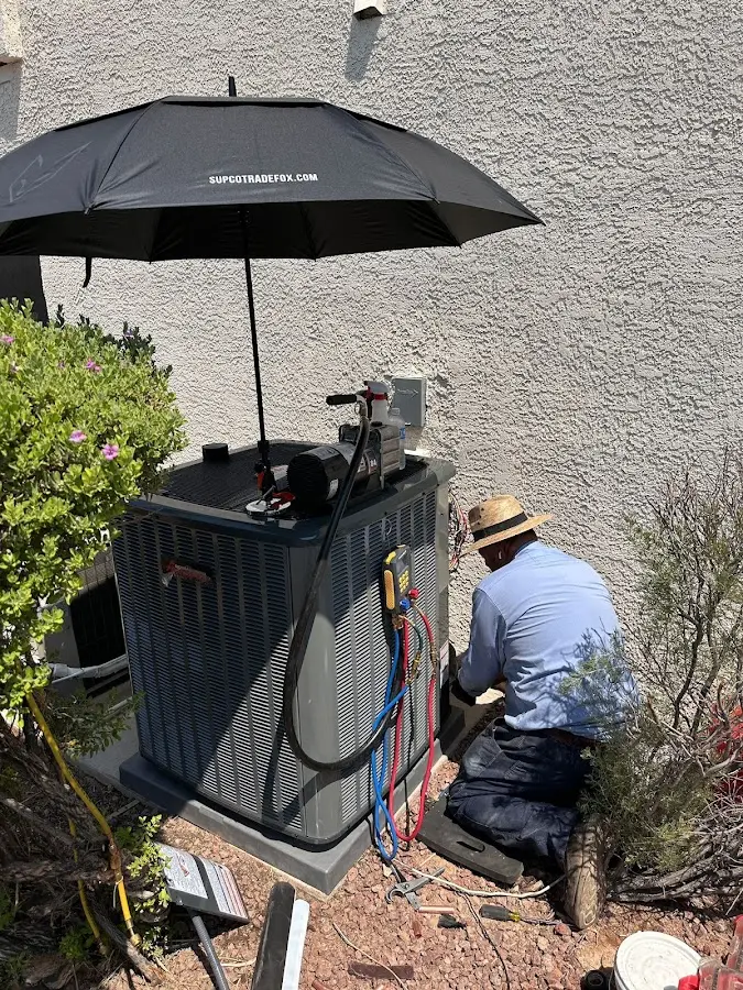HVAC technician performing outdoor AC maintenance in Santa Clara