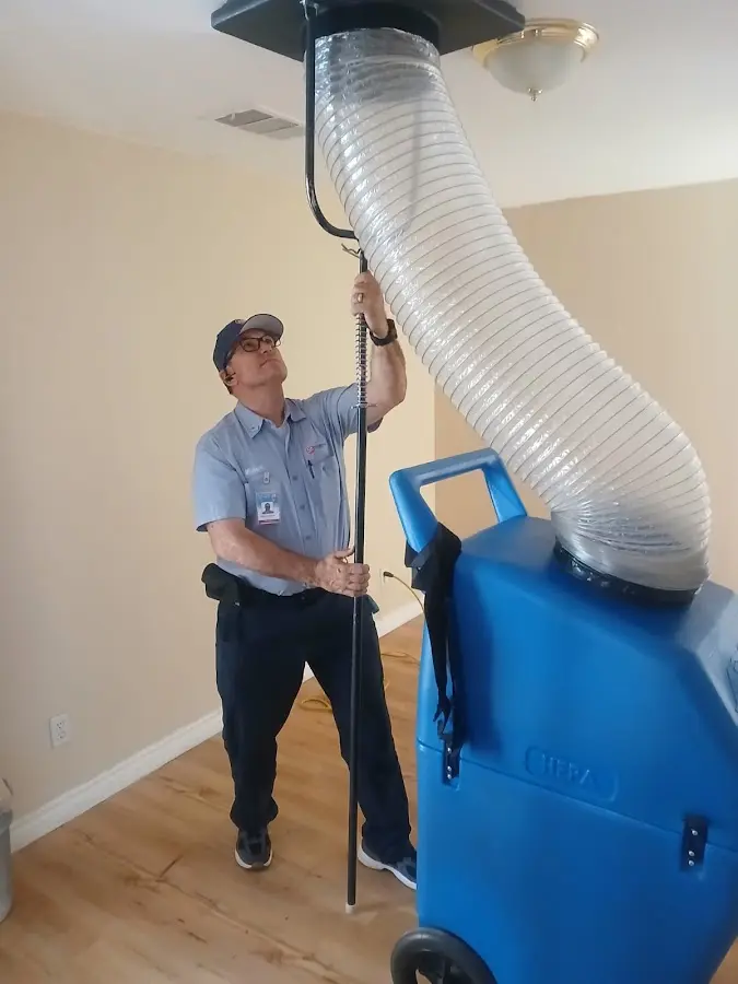 Furnace Tune-Up technician using HEPA equipment in Santa Clara
